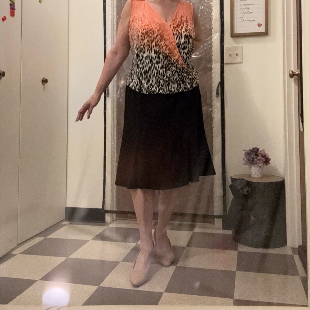 Orange and Black Animal Print Top With Black pocketed Slacks
